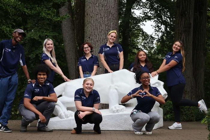 students standing around Nittany Lion Shrine